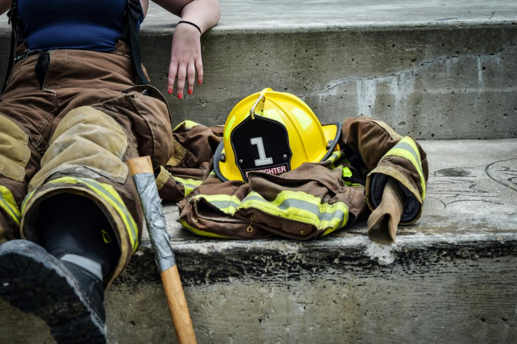 Yellow Hard Hat on Brown and Yellow Fireman's Suit