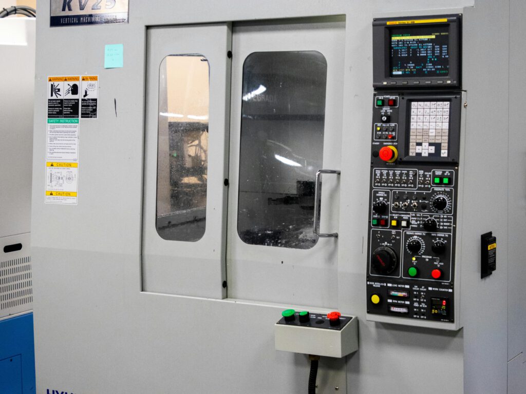 A machine with a large machine and a control panel